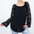 Black lace sleeve backless top from Yellow Hera, stylish blouse with elegant lace detailing and open back design.
