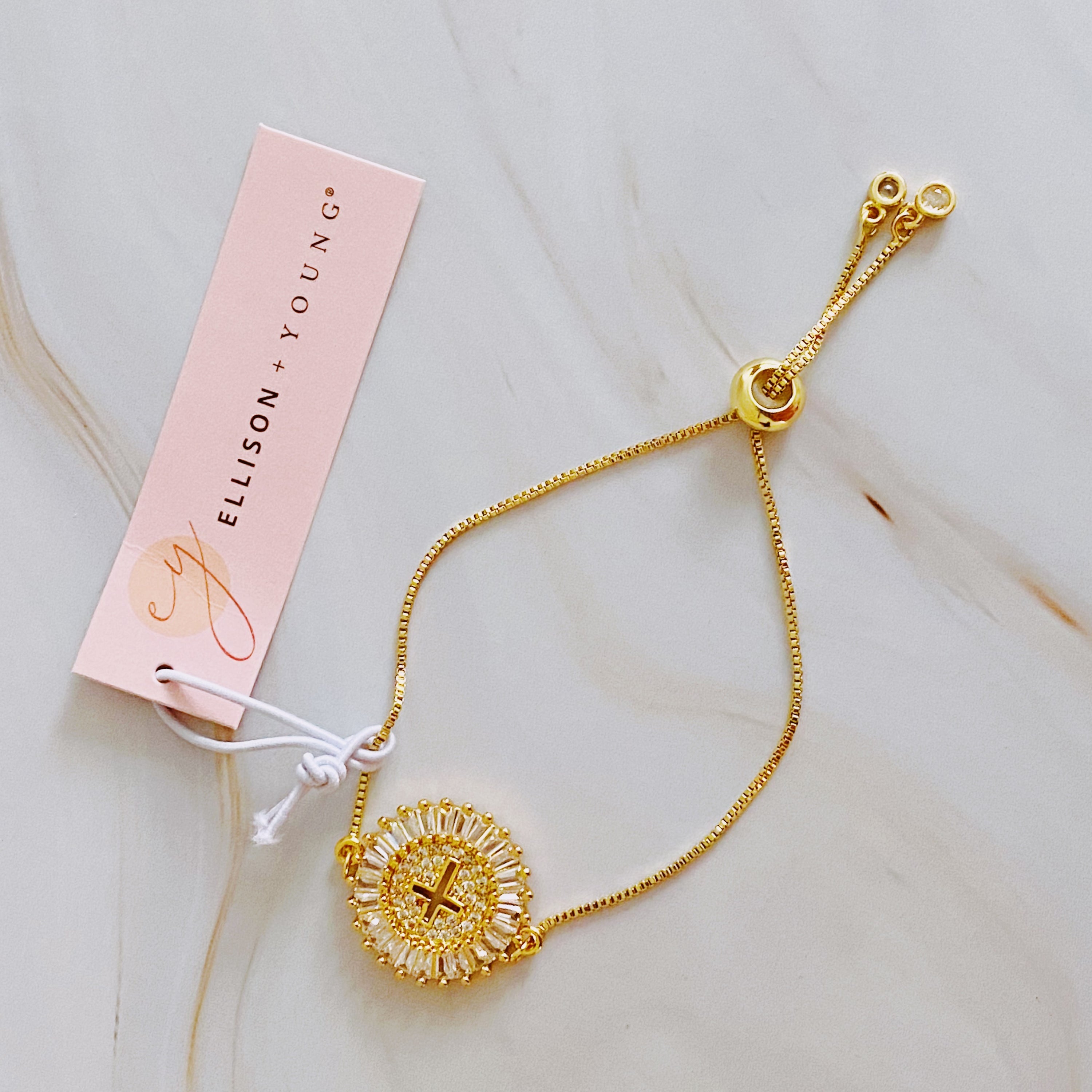 Fuchsia Hercules Mesmerized By The Cross Slide Bracelet featuring a silver-tone cross charm and adjustable chain for women.