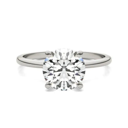 White Cassandra round lab-grown diamond solitaire earrings in 14K white gold with sparkling diamond accents.