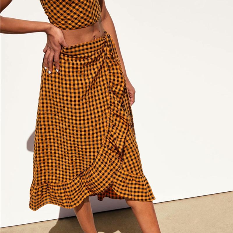 Yellow plaid ruffle midi skirt for women by Jade, high waist design with bow, stylish and elegant high fashion clothing.