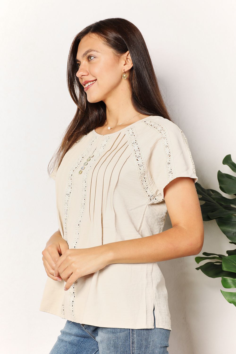 Pear Daisy Double Take Crochet Buttoned Short Sleeves Top, light-colored with crochet texture and button details.