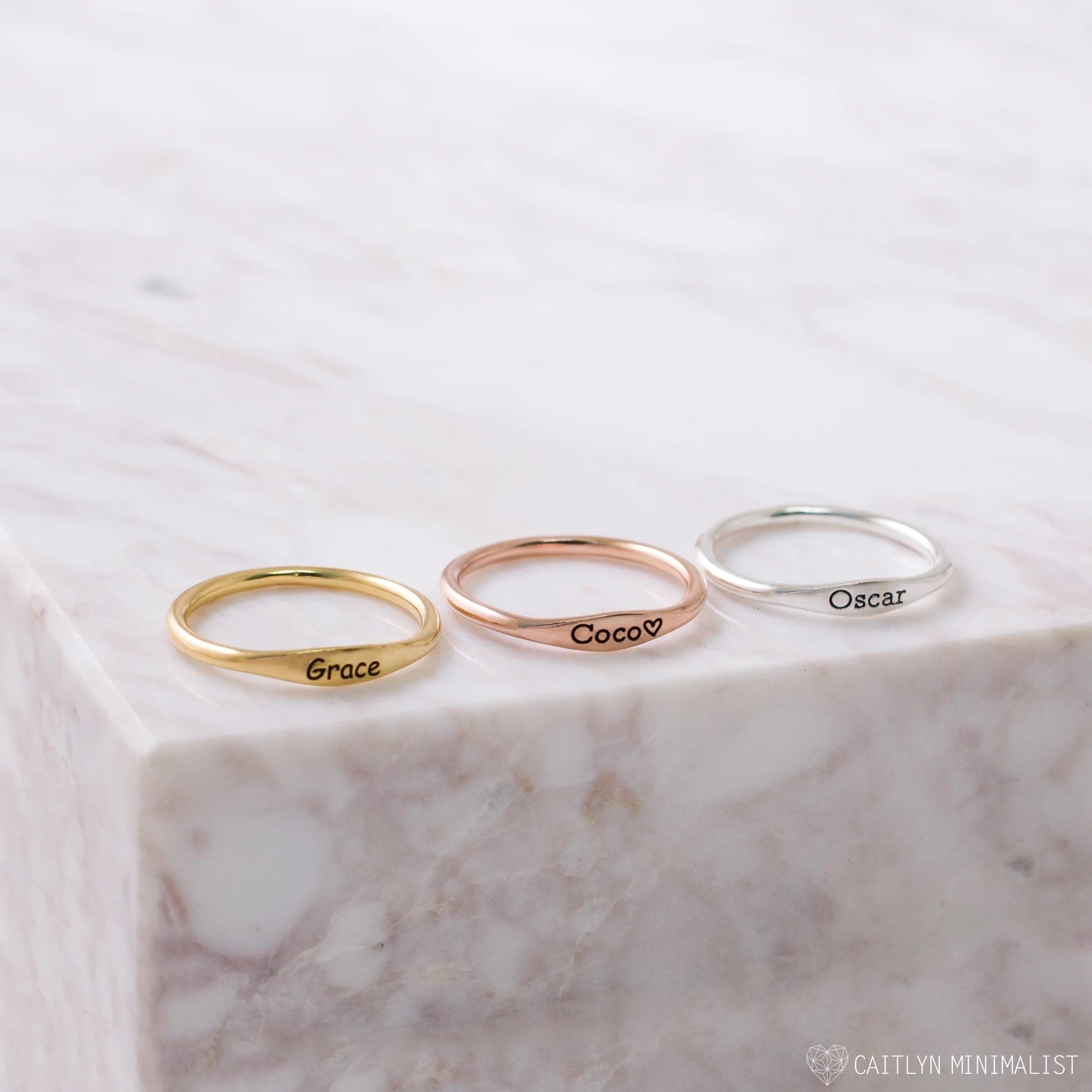 Delicate pink gold Tiny Name Ring by Pink Lucky, minimalist jewelry with a subtle engraved name on a slim band.