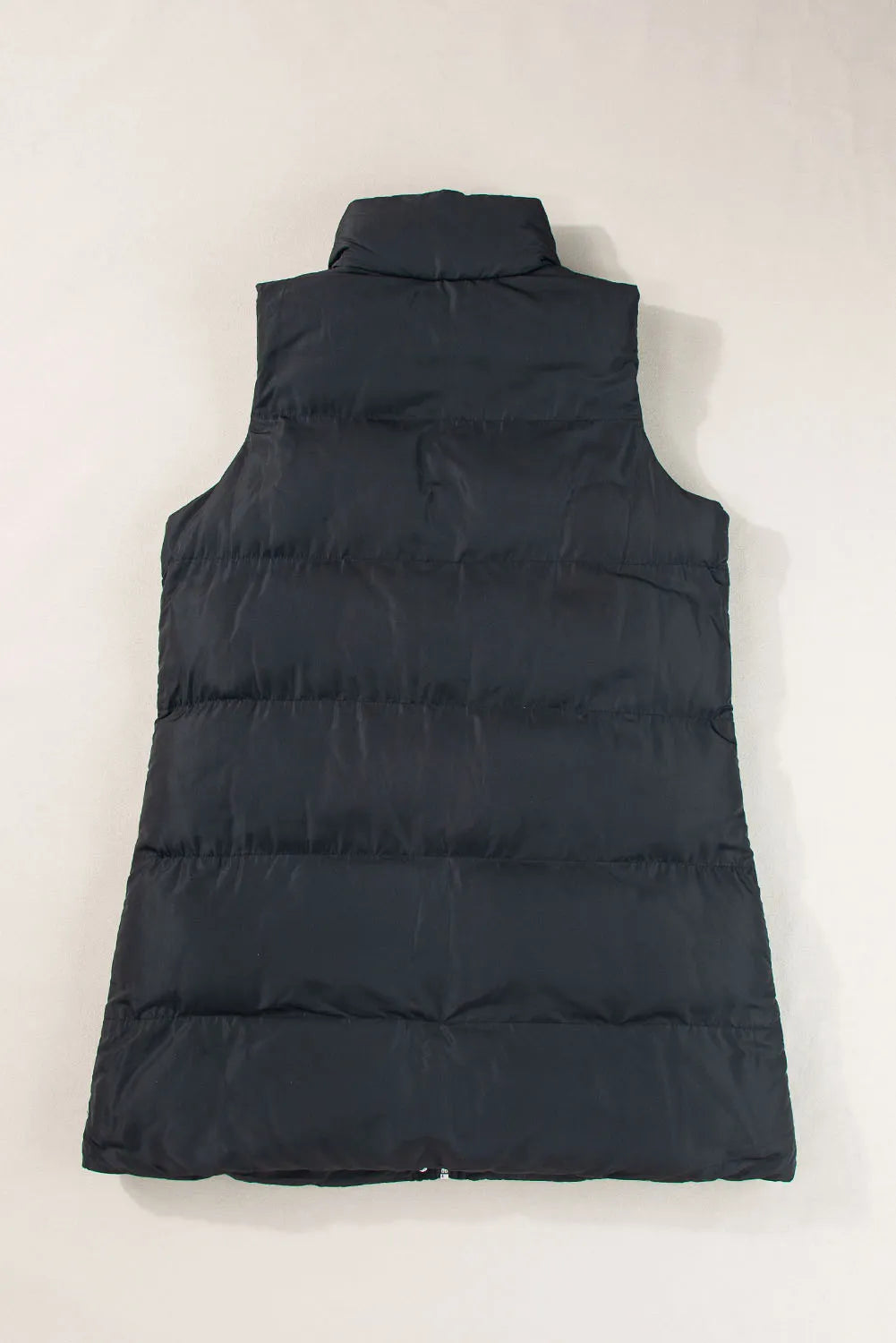 Pear Daisy pocketed zip-up vest coat for home and garden, shown in a cozy, casual outdoor setting.