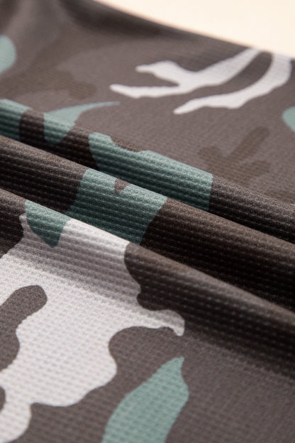 Camo textured drop shoulder long sleeve top by Byzantium Bay, featuring a relaxed fit and stylish camouflage pattern.