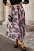 Peach Blossom floral embroidered high waist maxi skirt by Carmine Juneberry, featuring delicate floral leaf patterns and flowing fabric.