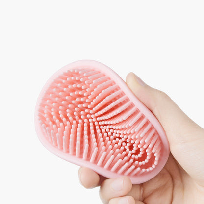 Maroon Asteria baby shower silicone brush for bathing, designed to gently remove dandruff and clean baby’s scalp during bath time.