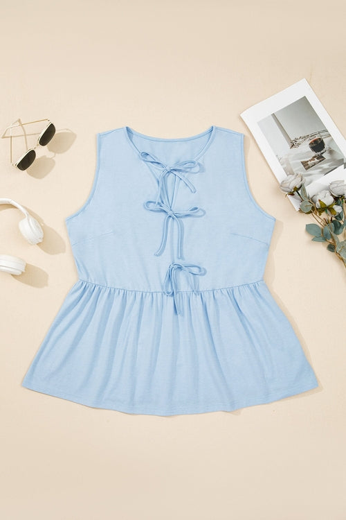 Plus size solid bow-tie peplum tank top for women by Byzantium Bay, featuring a stylish peplum design and bow detail.