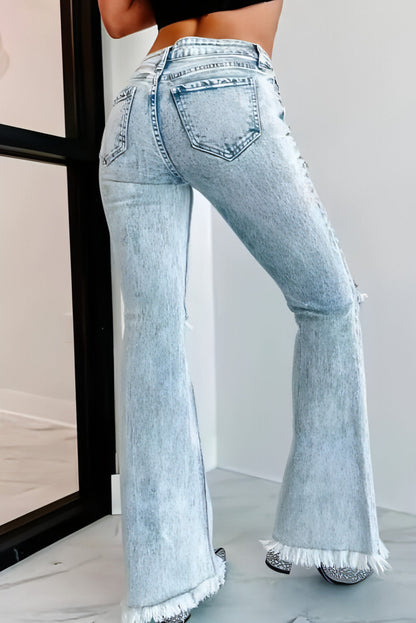 Carmine Juneberry UrbanEase™ high-waist ripped denim jeans with distressed details and classic blue denim fabric.