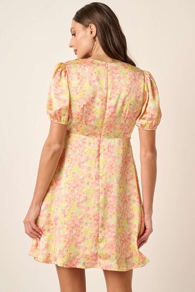 Jade Icarus Mittoshop printed V-neck puff sleeve mini dress in vibrant fabric, showcasing a stylish women&