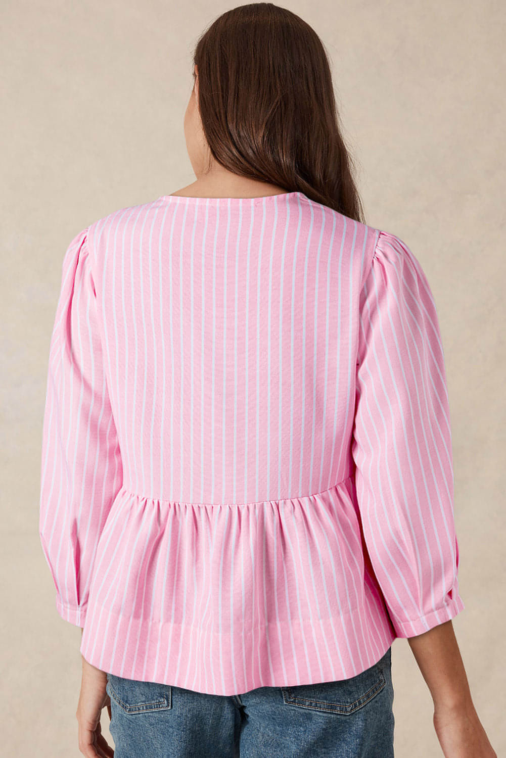 Pink striped bowknot front crew neck puff sleeve blouse by Carmine Juneberry, showing the front view with puffed sleeves and bow detail.