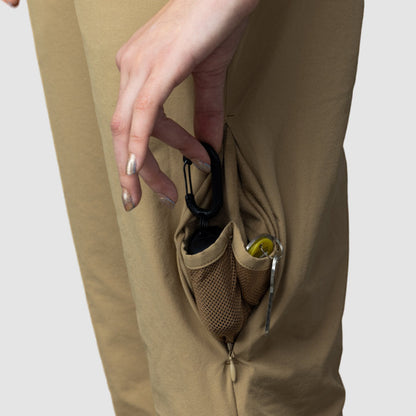 Women’s beige adventure pants by Rose Hemera, stylish activewear with a comfortable fit and functional design.