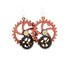 Red Sunflower Kinetic Gear Earrings 5001F, modern silver-toned jewelry with gear-inspired design, hanging from earlobes.