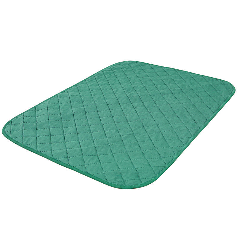 Natural bamboo fiber dog training pad by Maroon Asteria, designed for pets, placed on a soft bed or blanket.