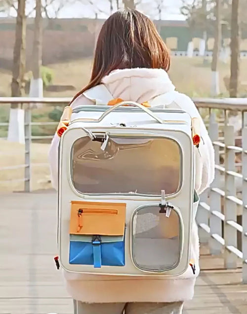 Pear Daisy rolling pet carrier with telescopic handle, designed for easy transport of small pets in home and garden settings.