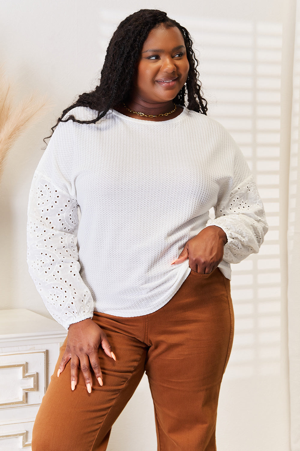 Shiny eyelet dropped shoulder round neck blouse by Pear Daisy, featuring a stylish design and lightweight fabric.