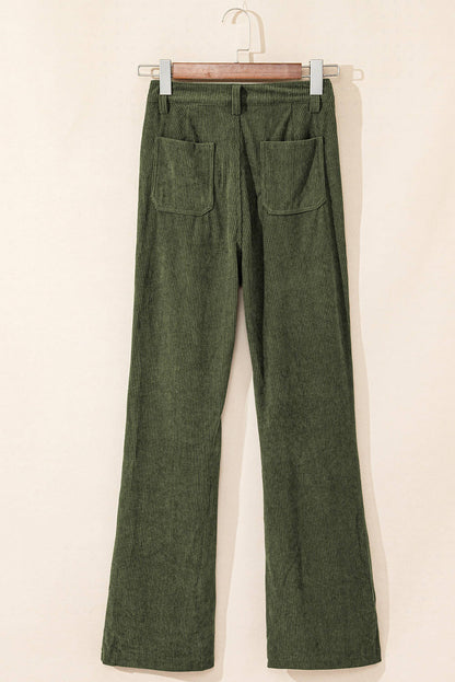 Green high waist corduroy pants with square pockets by Carmine Juneberry, shown on a model.