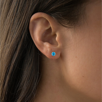 Natural Swiss Blue Topaz stud earrings in 14K white gold with 2.00 CTW, featuring vibrant blue gemstones and sleek jewelry design.