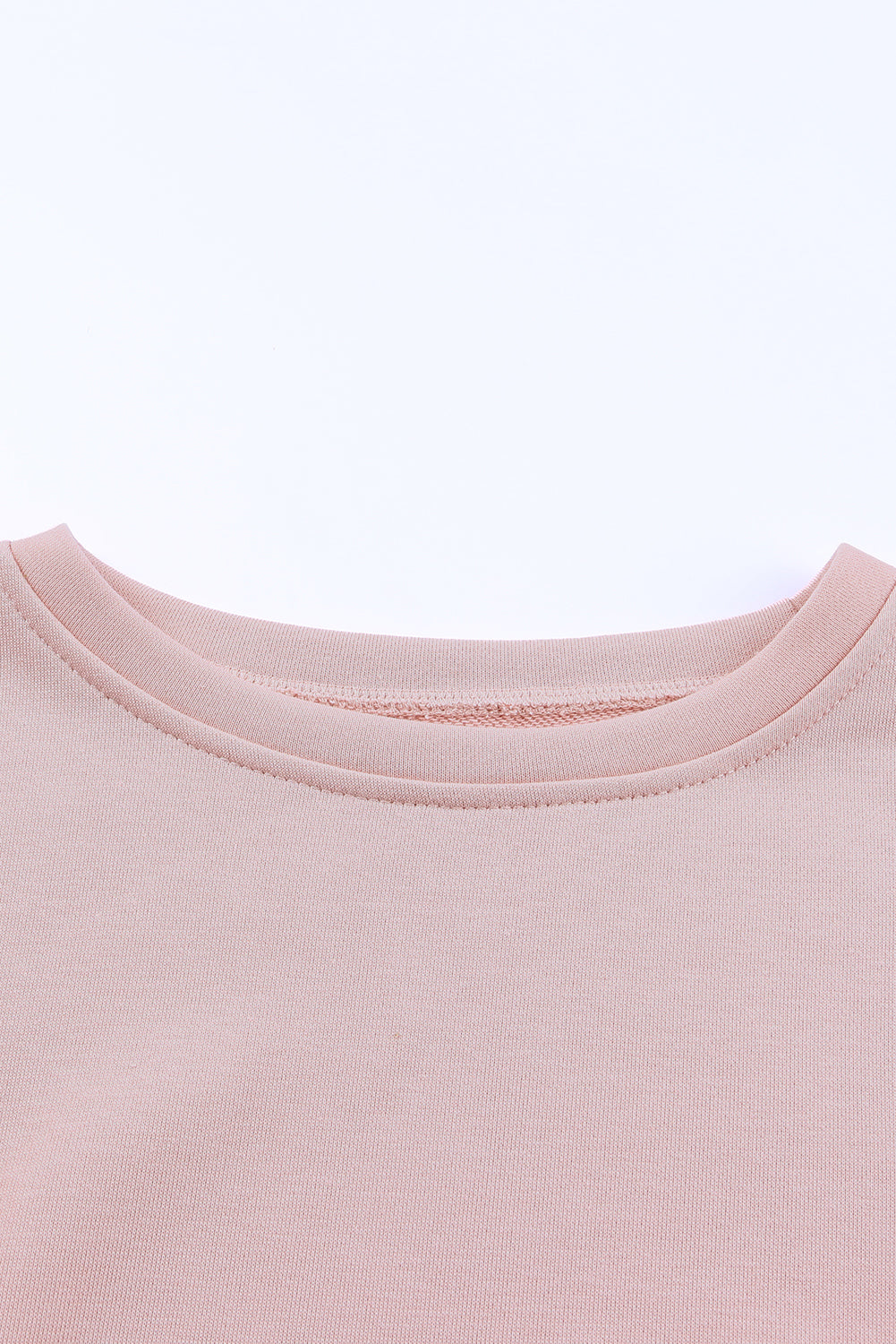 Pink crew neck sweatshirt with slit buttons by Harlequin Daisy, featuring a casual, stylish design for bath and beauty wear.