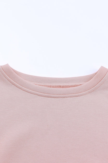 Pink crew neck sweatshirt with slit buttons by Harlequin Daisy, featuring a casual, stylish design for bath and beauty wear.