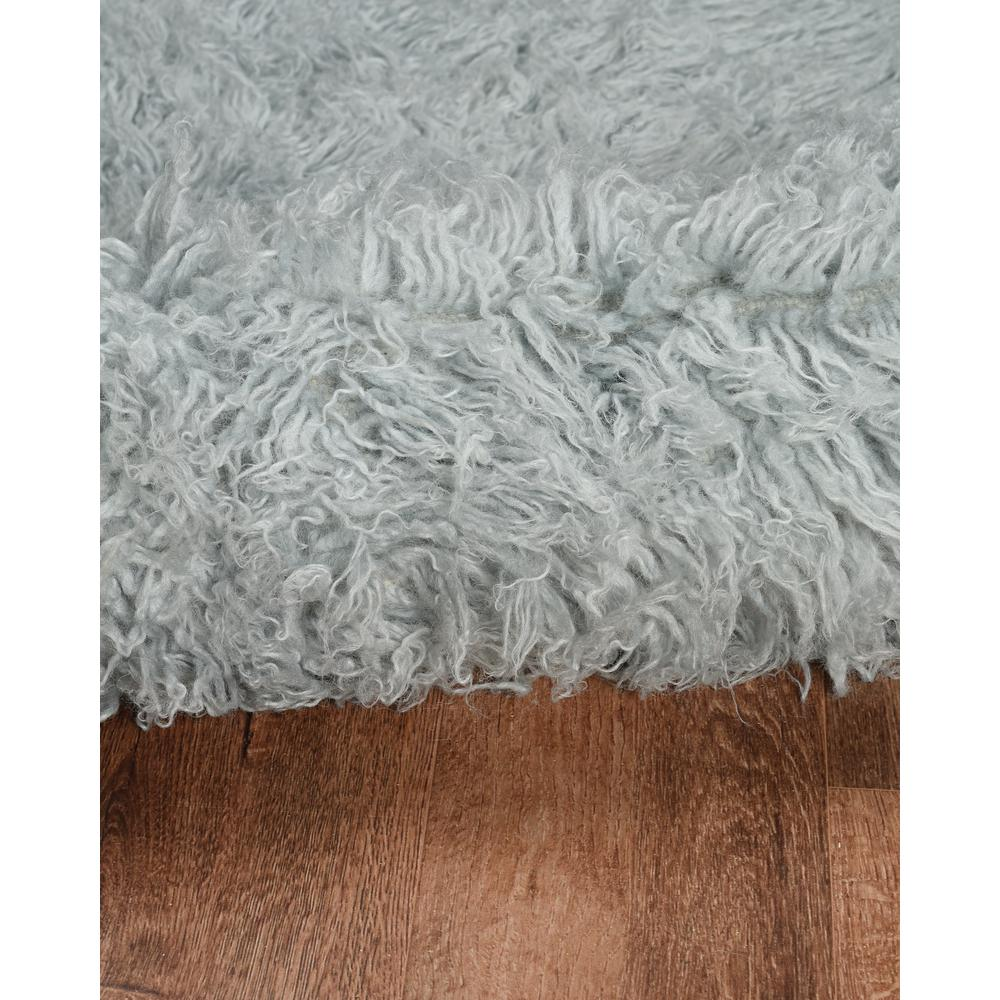 Light grey Flokati rug by Start2Finish, 5x8 feet, plush 1400-gram wool texture, ideal for cozy living spaces.