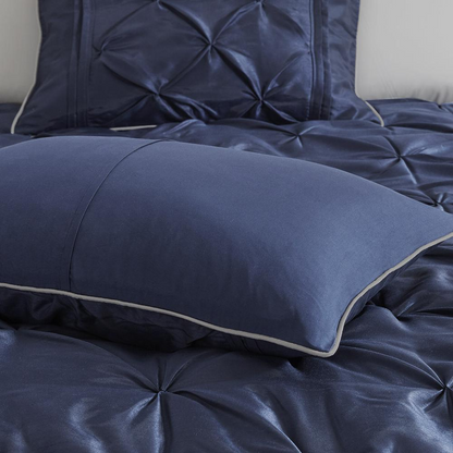 Start2Finish Laurel 7-piece navy tufted comforter bedding set with matching pillow shams and decorative accents.