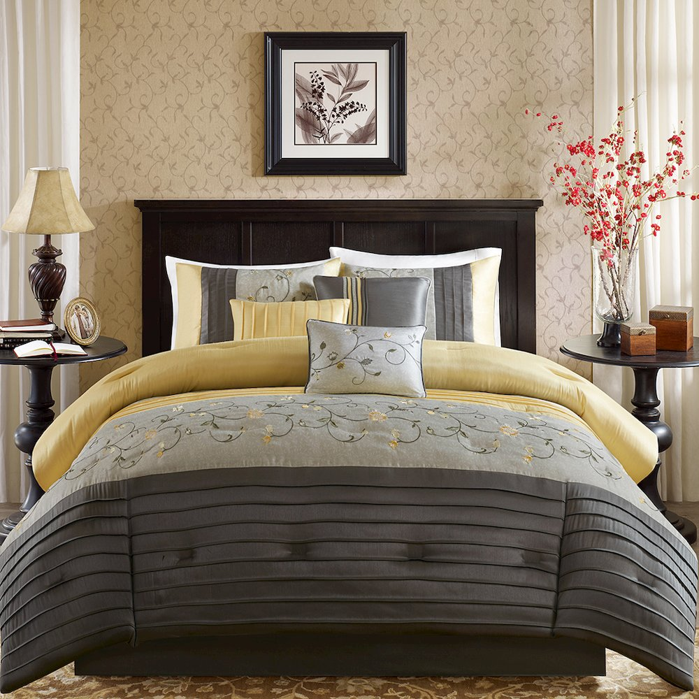 Start2Finish embroidered 7-piece comforter set with intricate floral designs and matching pillow shams on a neatly made bed.