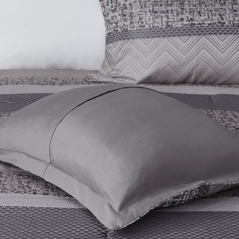 Start2Finish 7-piece Jacquard comforter set with intricate woven pattern and matching pillow shams on a neatly made bed.
