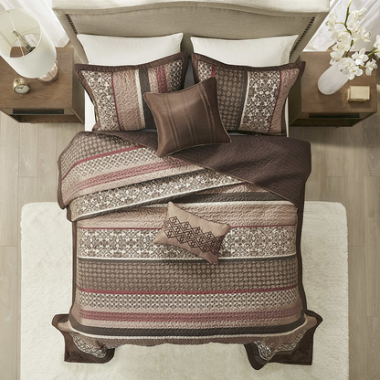 Start2Finish 5-piece reversible jacquard bedspread set with intricate patterns and coordinating pillow shams on a neatly made bed.