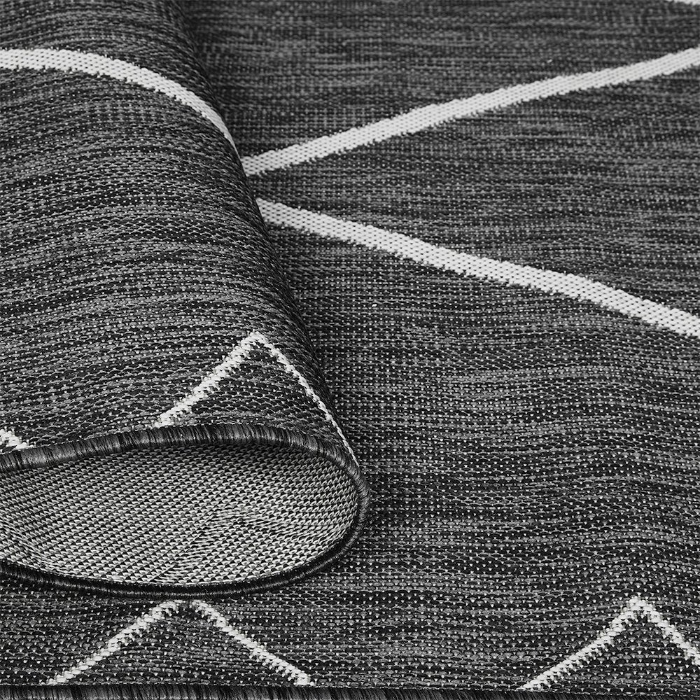 Start2Finish Moroccan indoor/outdoor rug with intricate geometric patterns in vibrant colors on a durable fabric surface.