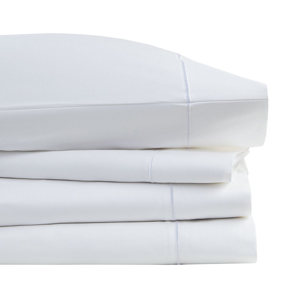 Start2Finish Pima cotton sheet set with smooth, white bedding, featuring a neatly made bed with matching pillowcases and crisp linens.