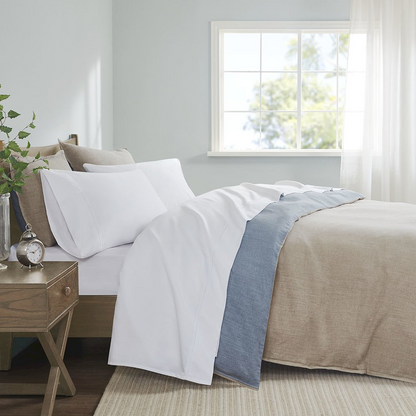 Start2Finish Pima Cotton Sheet Set with smooth, soft white sheets and pillowcases, showcasing the luxurious fabric and neat bedding arrangement.