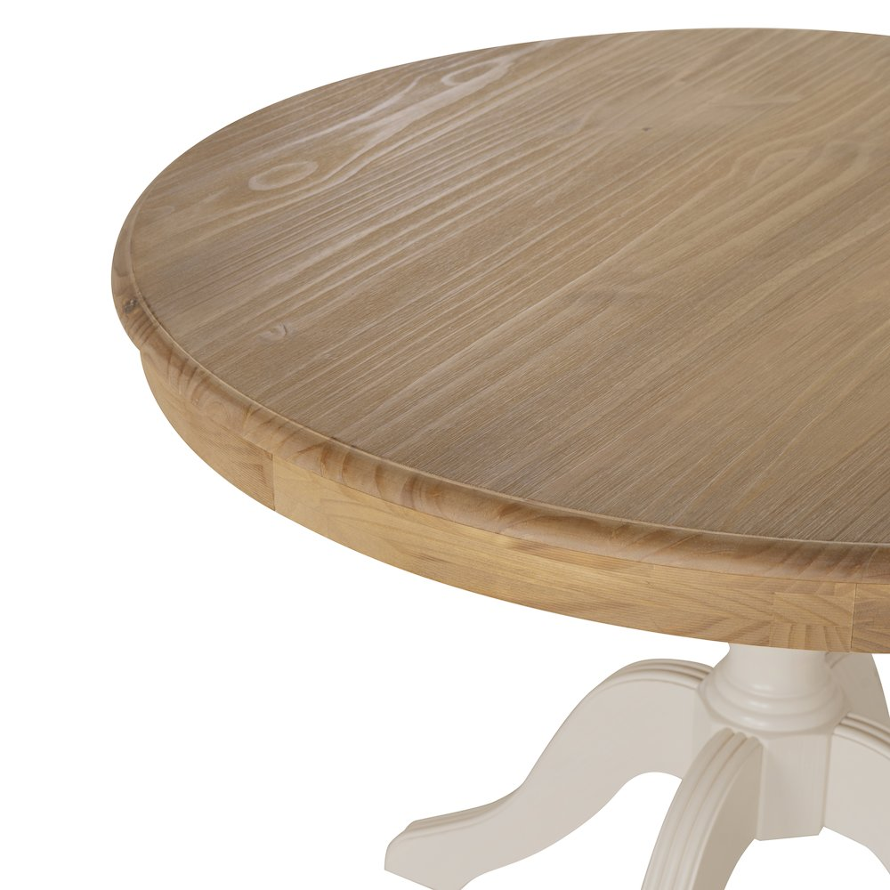Tobin Pedestal Dining Table by Start2Finish with natural wood top and white base, shown in a modern dining room setting.