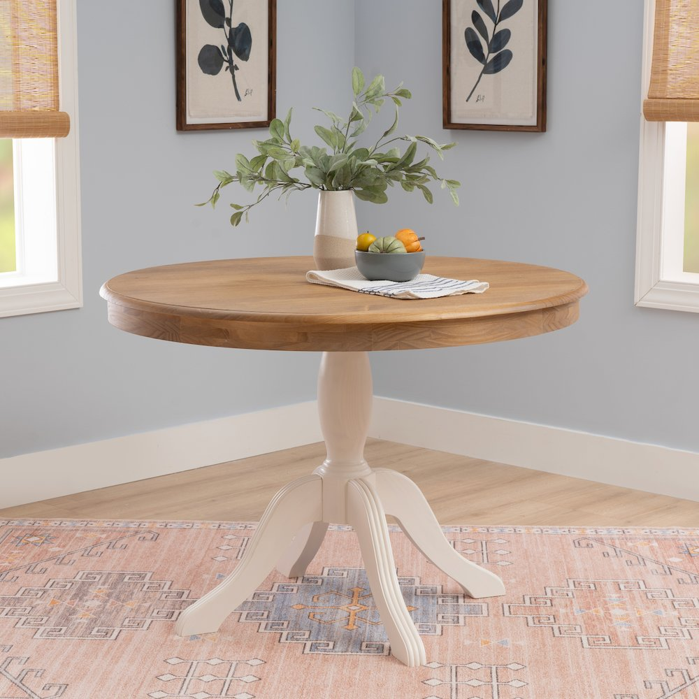 Start2Finish Tobin Pedestal Dining Table in natural wood and white finish, showcasing the smooth round tabletop and sturdy pedestal base.