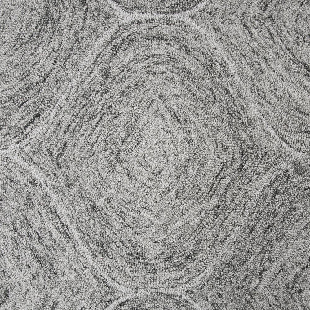 Hand tufted wool rug with loop pile in a 5&