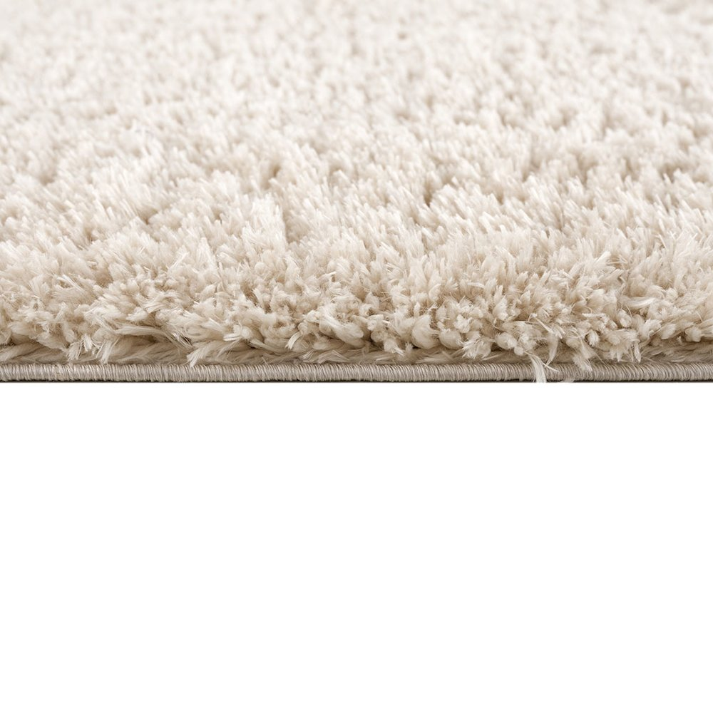 Super soft polyester shag area rug by Start2Finish with plush, textured surface in neutral tones, perfect for cozy living spaces.