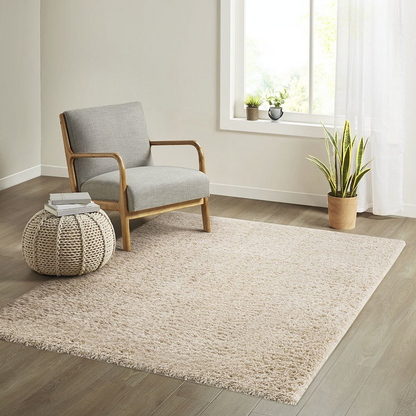 Super soft polyester shag area rug by Start2Finish with plush, thick pile and textured surface in neutral tones.