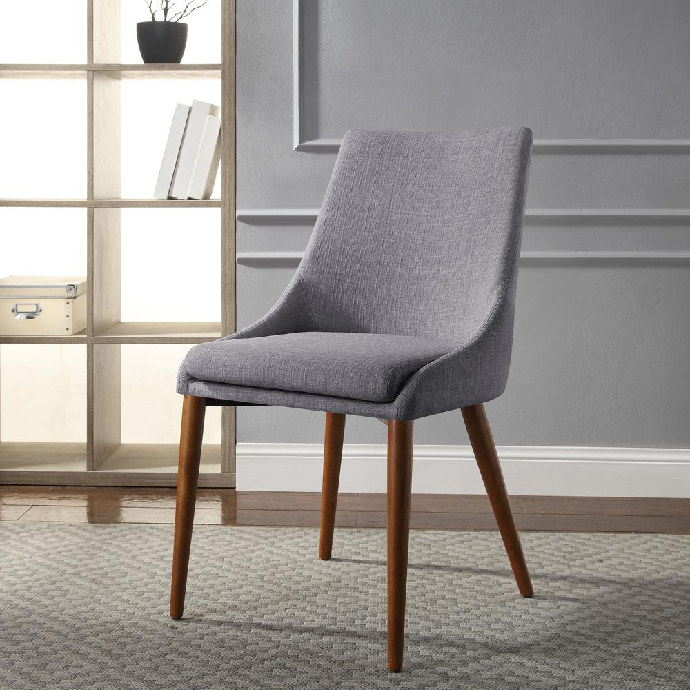 Two Palmer Mid-Century Modern fabric dining accent chairs in dove color with wooden legs from Start2Finish, shown from a side angle.