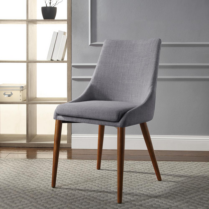 Two Palmer Mid-Century Modern fabric dining accent chairs in dove color with wooden legs from Start2Finish, shown from a side angle.