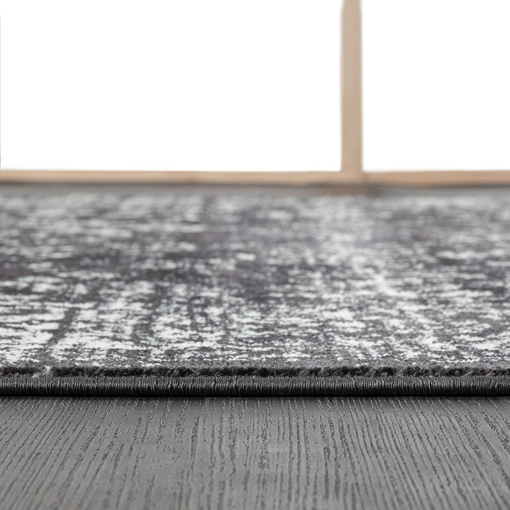 Distressed vintage Persian woven area rug with intricate patterns in warm earth tones, crafted by Start2Finish.