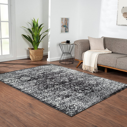 Distressed vintage Persian woven area rug with intricate patterns and a worn, rustic appearance, showcasing rich earthy tones.