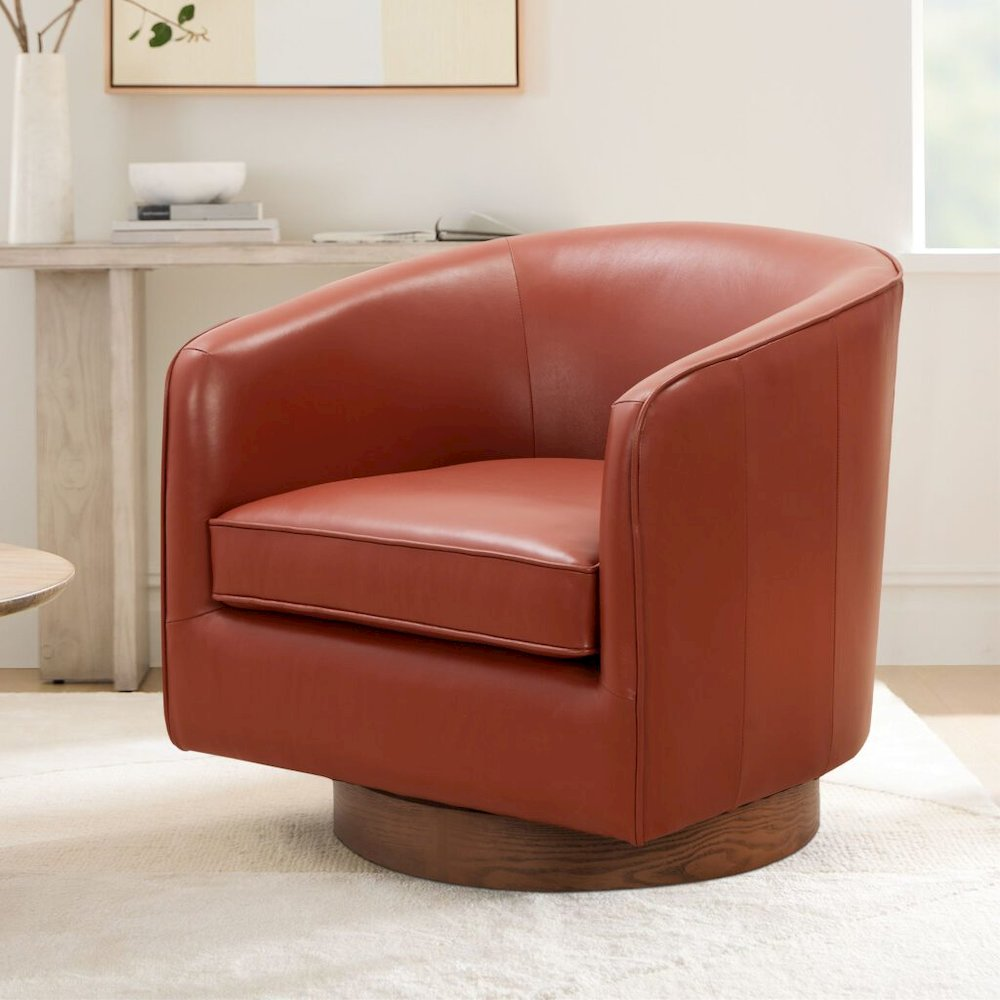 Start2Finish Taos caramel top grain leather swivel chair with wood base, showcasing its plush leather upholstery and modern design.