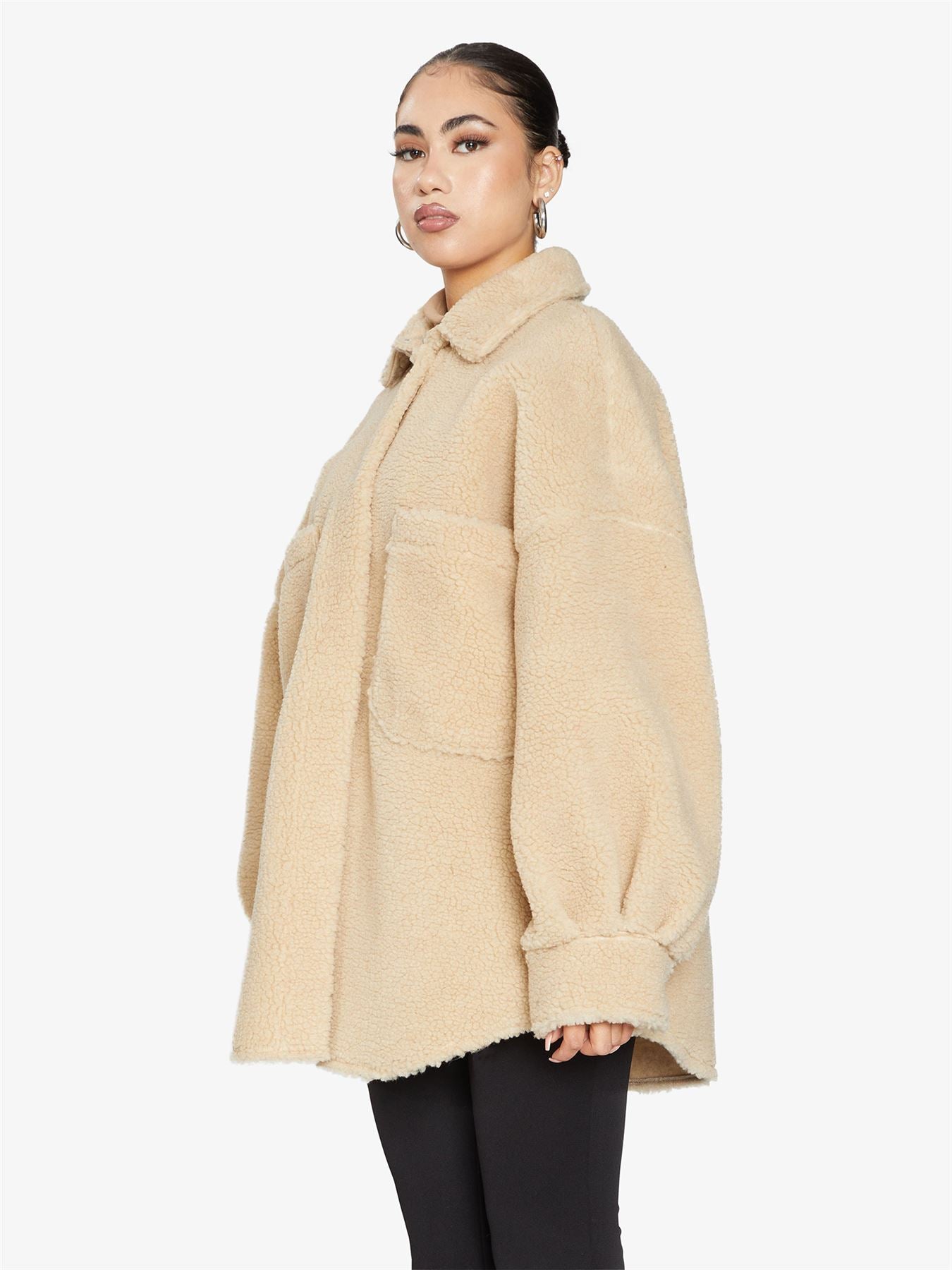 Rose Eleusis oversized patch pocket borg teddy shacket featuring a plush, textured exterior and large patch pockets.