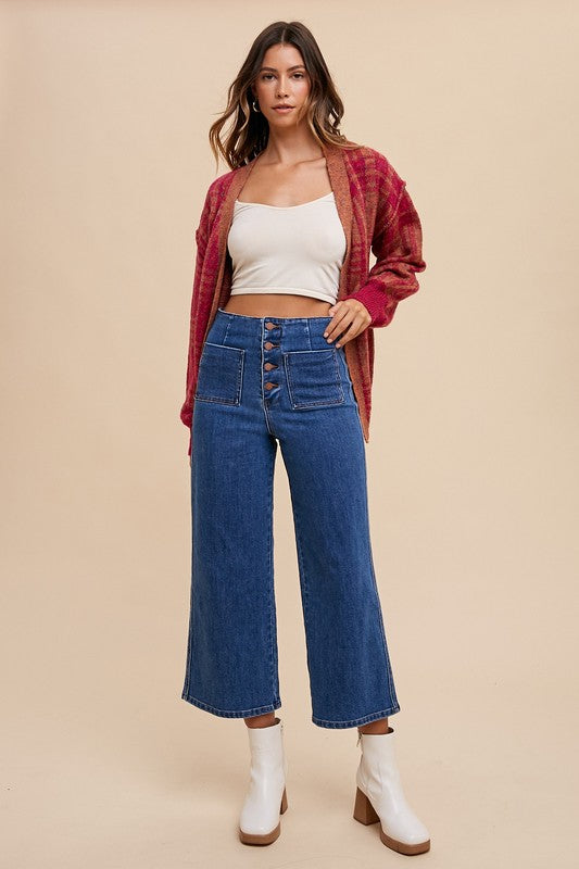 Jade Icarus Annie Wear button fly high waist jeans with classic denim look and detailed stitching, displayed on a hanger.