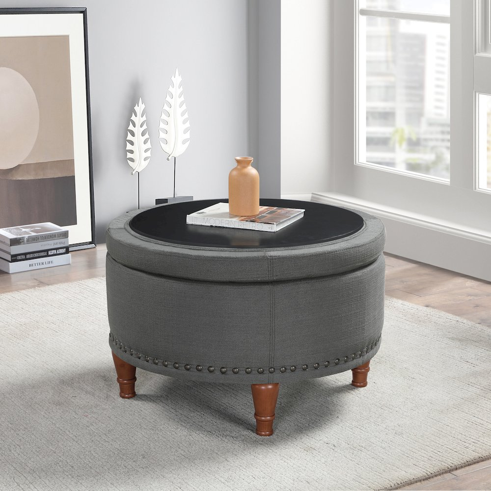 Start2Finish Alloway storage ottoman in charcoal fabric with antique bronze nailhead trim, showing its cushioned top and elegant design.