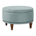 Start2Finish Alloway storage ottoman in sea blue fabric with antique bronze nailhead trim, showing its padded top and decorative nail accents.