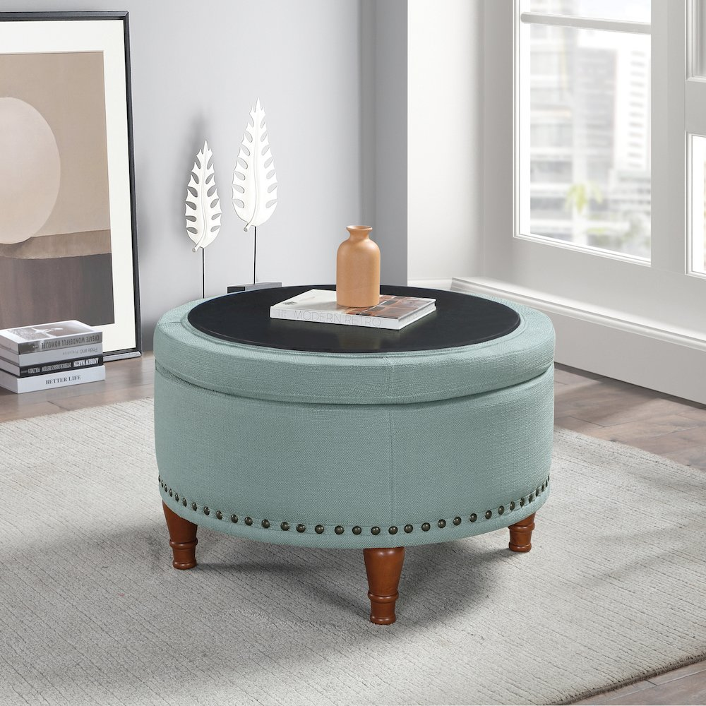 Start2Finish Alloway storage ottoman in sea blue fabric with antique bronze nailhead accents, showcasing its plush, functional design.