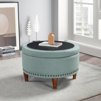 Start2Finish Alloway storage ottoman in sea blue fabric with antique bronze nailhead accents, showcasing its plush, functional design.