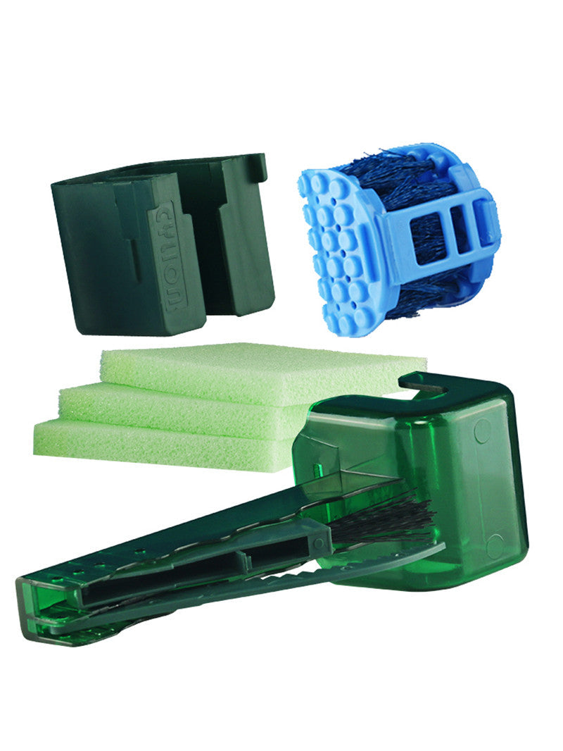 Maroon Asteria bicycle chain cleaner scrubber brush for cycling maintenance, shown with cleaning kit components on a workbench.