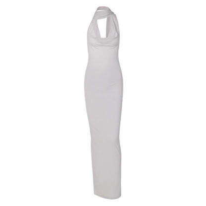 Green Alcestis slim backless halter neck dress, showcasing its elegant design and open back with halter straps.