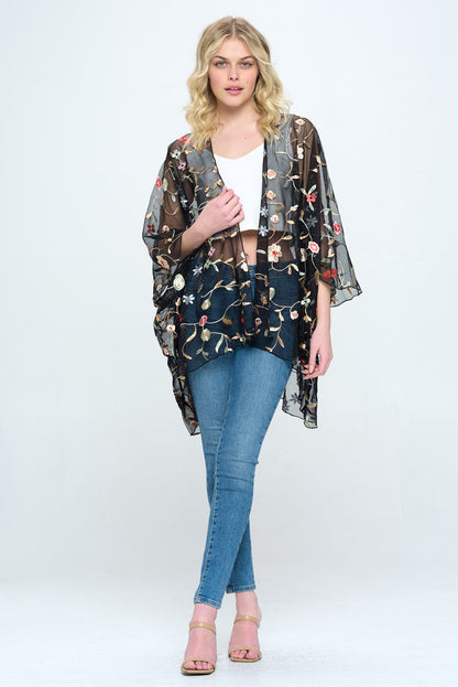 Floral embroidered mesh oversized kimono for women by Indigo Arrowwood, featuring colorful floral patterns and lightweight sheer fabric.
